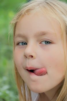 Portrait of girl with smile and makes faces