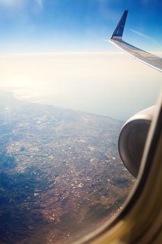 land and sea from the illuminator of airplane