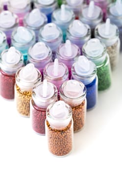 Small Glass Jars filled with Balls of Bead, closeup