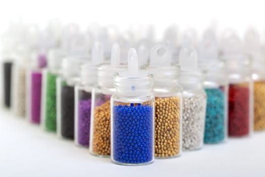 Small Glass Jars filled with Balls of Bead, closeup