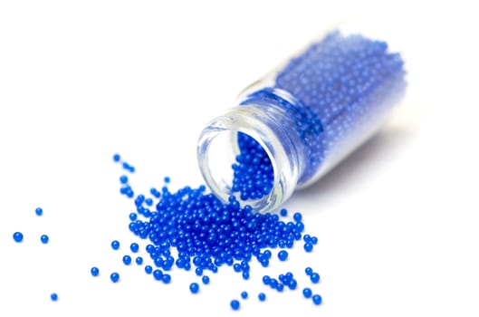 Small Glass Jar filled with Blue Balls of Bead, closeup