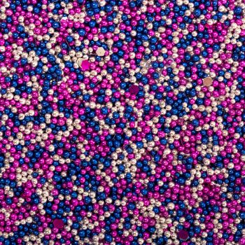 Background from White, Blue and Pink  Balls of Bead, nail decoration caviar