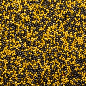 Background from Yellow and Black Balls of Bead, nail decoration caviar