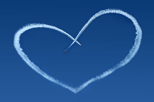 Airplanes Skywriting a Heart on blue sky