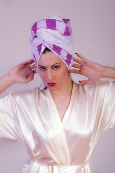 portrait of beautiful woman with a towel on her head