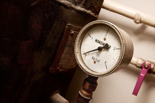 Manometer on an old rusty gas tank