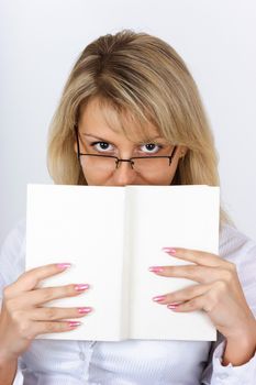 Portrait of an attractive blonde with a book