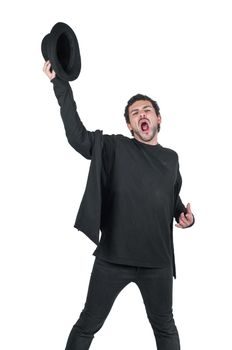 Man in black with hat in hand yelling