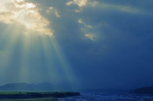 God light shining on lahar-covered river