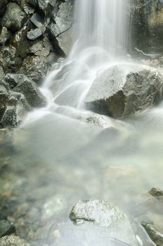 Small natural waterfall in a mountain 