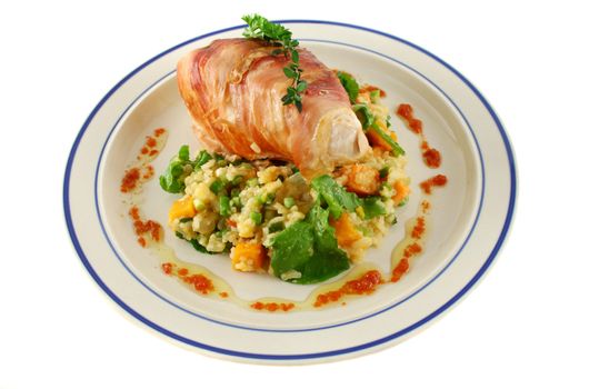 Chicken wrapped in prosciutto on pumpkin and rocket risotto.