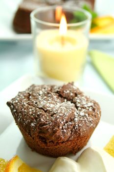 Chocolate brownie with icing sugar ready to serve.