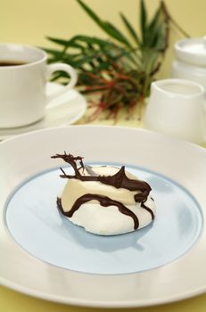 Delicious chocolate meringue with coffee and milk ready to serve.