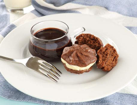 Delicious fresh baked chocolate star biscuits with chocolate sauce.