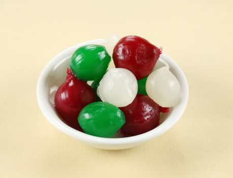 Different colored cocktail onions in a bowl ready to serve.