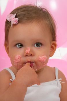 Baby eating her birhtday cupcake