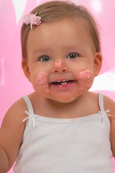 Baby happy after eating her birhtday cupcake