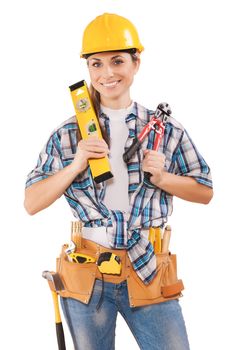 beautiful female worker holding tools