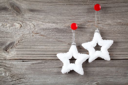 white christmas stars and sample text on wooden background