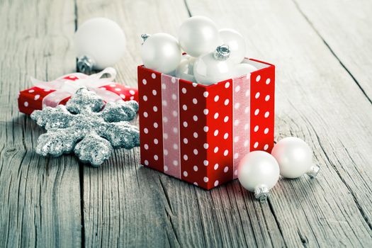 red gift box, polka dots with, on wood background