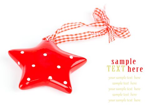 Christmas star ornament of porcelain, on white background