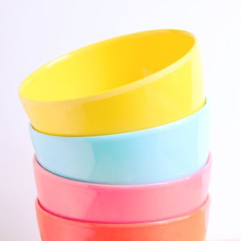 Stack of colorful plastic bowl with retro filter effect