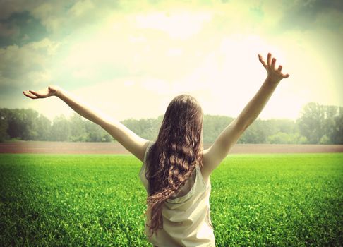 Vintage photo of Happy teenage girl in the summer field