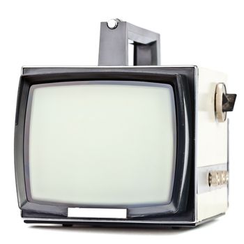 Vintage portable television set on white background