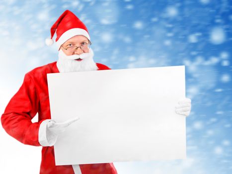 Santa Claus with Empty white Board on abstract winter background