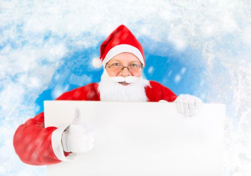 Happy Santa Claus with Empty white Board on abstract winter background