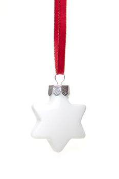 white christmas bauble as christmas star hanging isolated with white background 