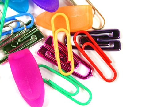 Various types of paper clips isolated on a white background.