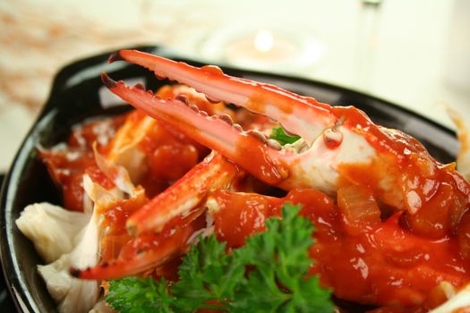 Delicious fresh cracked sand crab in a spicy tomato sauce with parsley.