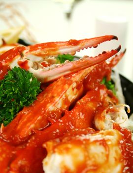 Delicious fresh cracked sand crab in a spicy tomato sauce with parsley.