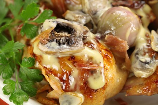 Delicious creamy baked mushrooms with chicken and flat leaf parsley.