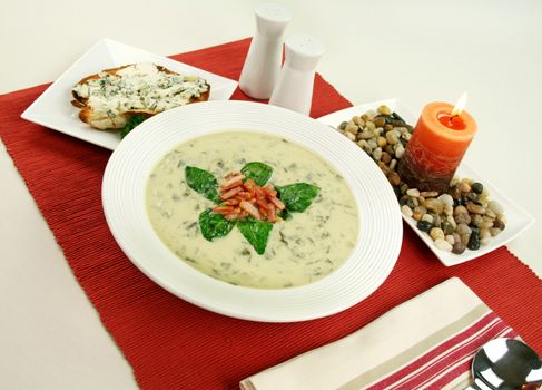 Creamy spinach soup with crispy bacon and blue cheese toast.