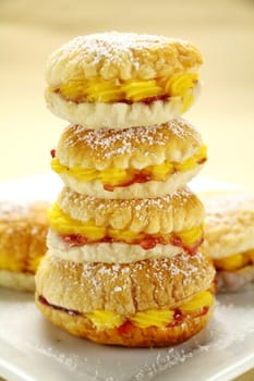 Custard pastry cakes stacked on top of one another.