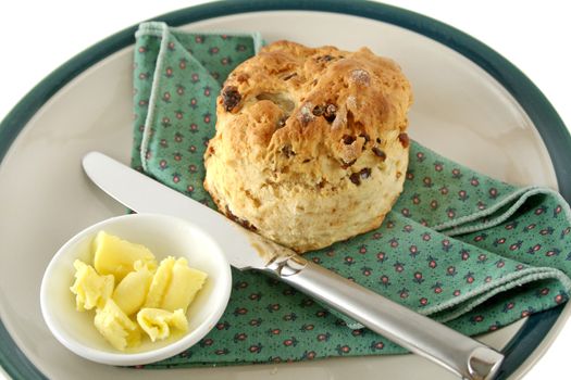 Fresh baked date scone with butter curls.