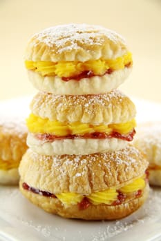 Custard pastry cakes stacked on top of one another.