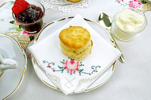 Devonshire tea and fresh baked scones with jam and cream.