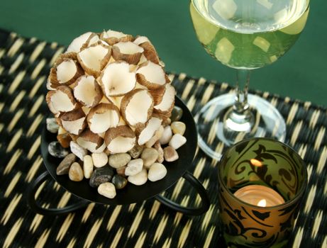 Table decoration with white wine and candle.