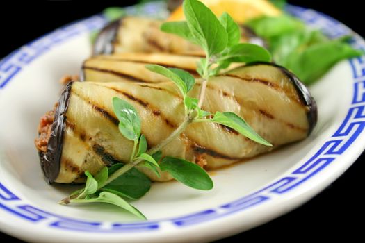 Chargrilled egg plant and beef rolls with an orange and fennel salad.