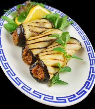 Chargrilled egg plant and beef rolls with an orange and fennel salad.