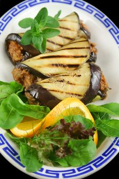 Chargrilled egg plant and beef rolls with an orange and fennel salad.