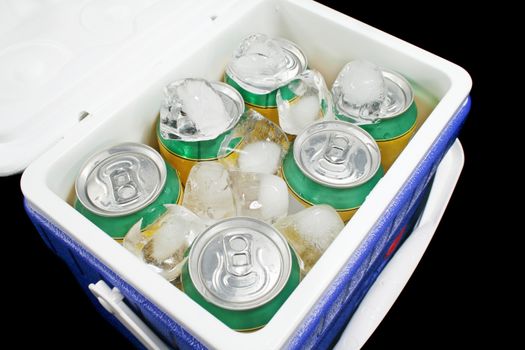 Icy cold cans of drink in a plastic cooler.