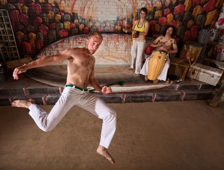 Capoeira group performing martial arts and music