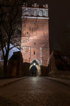 Opatowska gate in Sandomierz by night, Poland