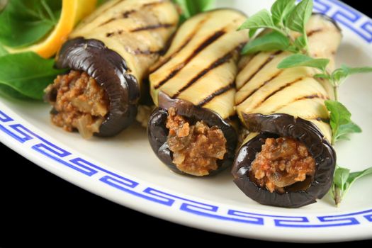 Chargrilled egg plant and beef rolls with an orange and fennel salad.