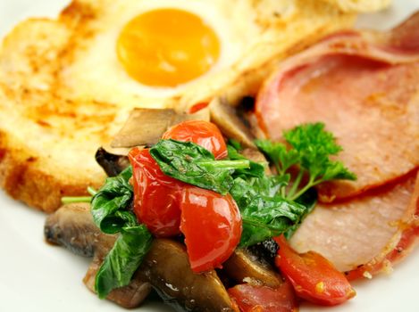 Bacon, mushrooms, spinach and tomatoes with egg in toast.