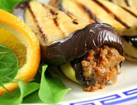 Chargrilled egg plant and beef rolls with an orange and fennel salad.